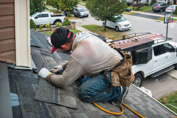 Professional Roofing technician working in Millis, MA